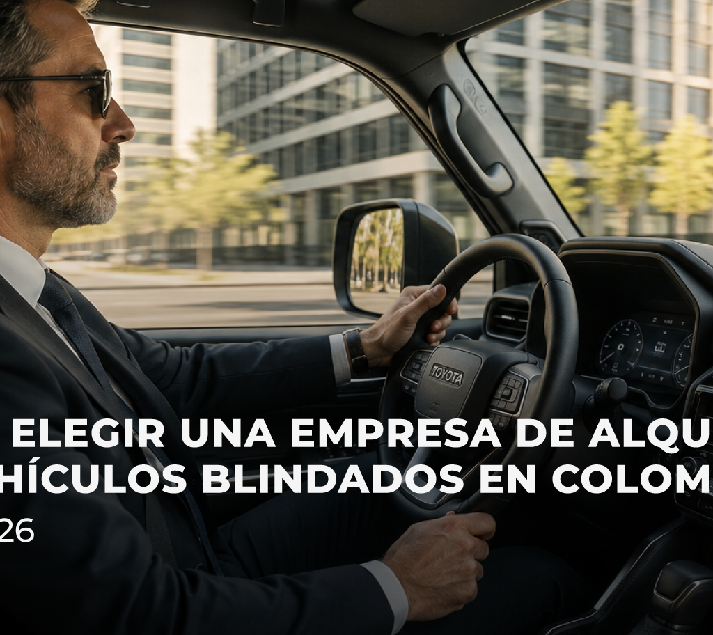 Camioneta blindada circulando frente a edificios corporativos en una zona empresarial de Colombia.
