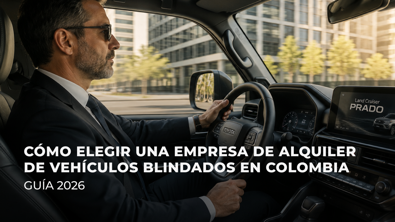 Camioneta blindada circulando frente a edificios corporativos en una zona empresarial de Colombia.